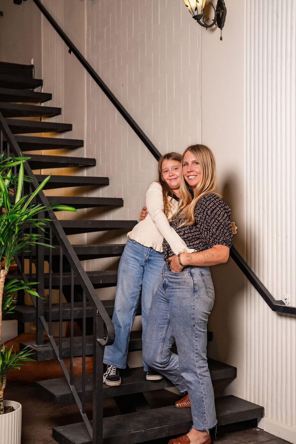 Elizabeth Croteau with her daughter Murphie on the stairs at Chariot.